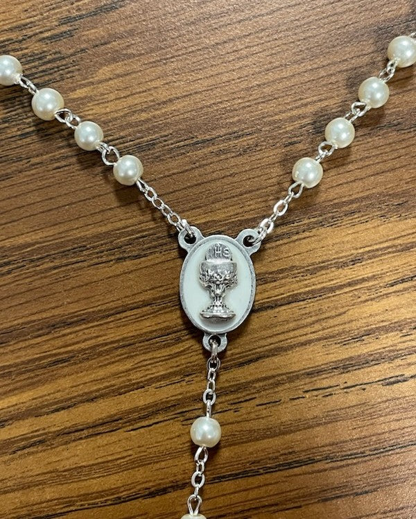 WHT PEARL ENAMEL CRUCIFIX COMM