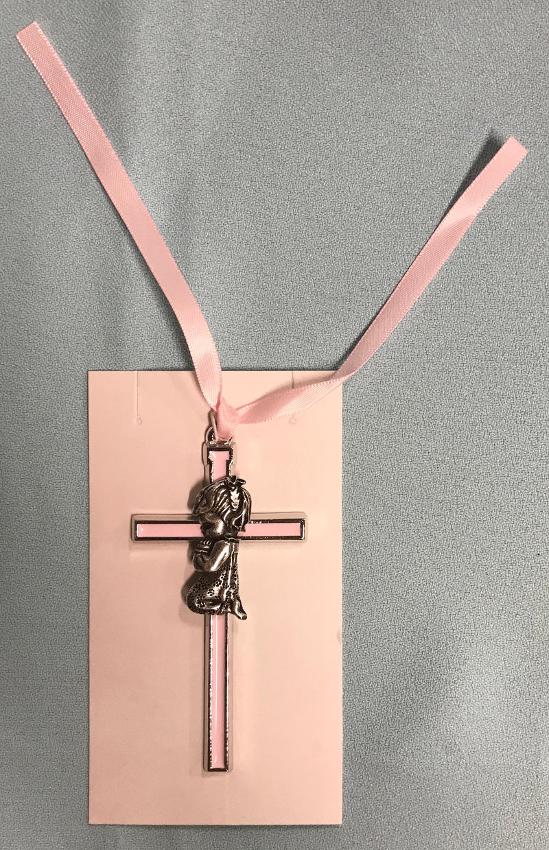 Pink crib cross with silver colored girl kneeling and praying.